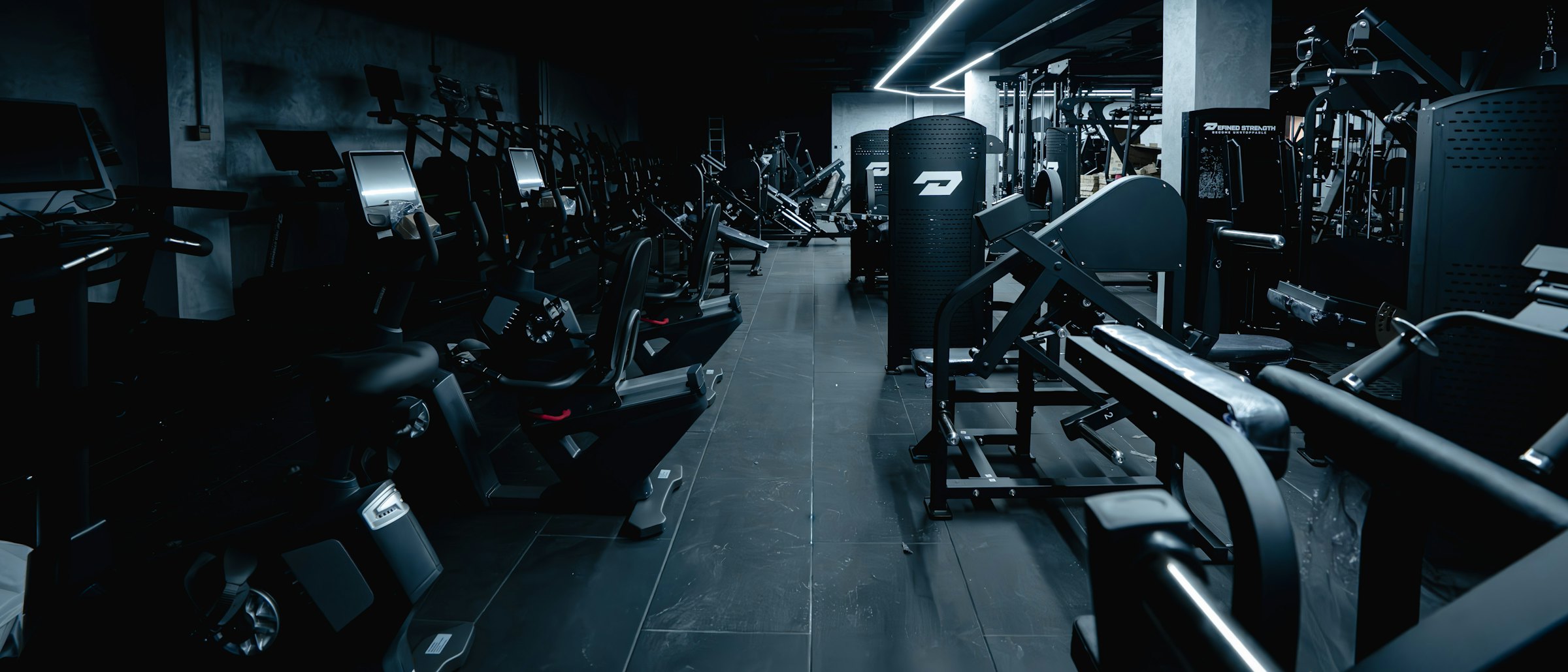 The Ironleaf training floor with racks and rowers