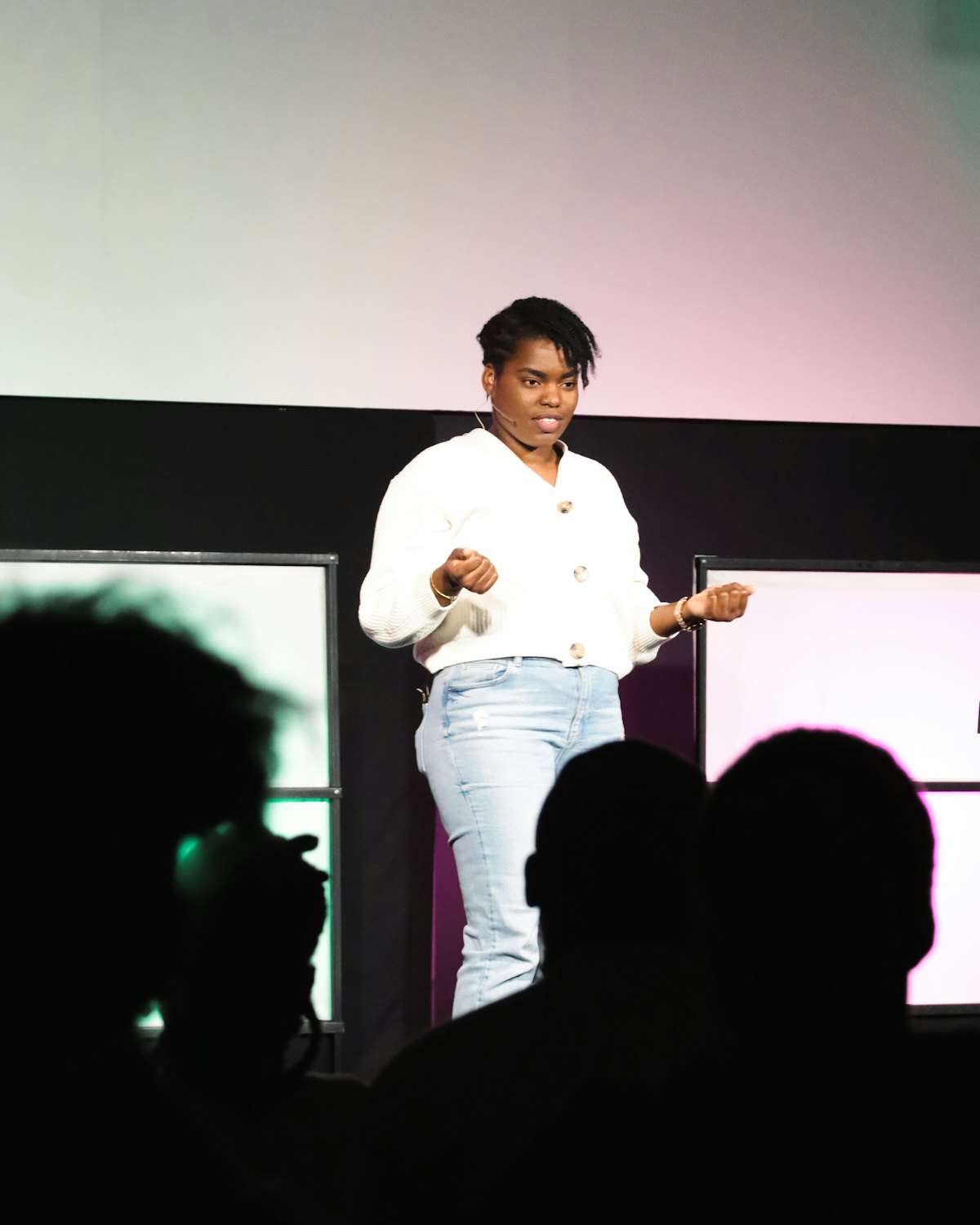 Maya on stage at a founders conference