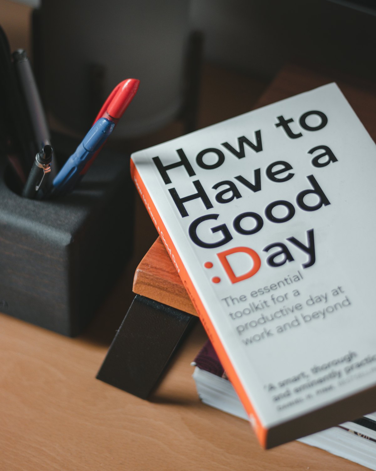 A stack of the book on a desk