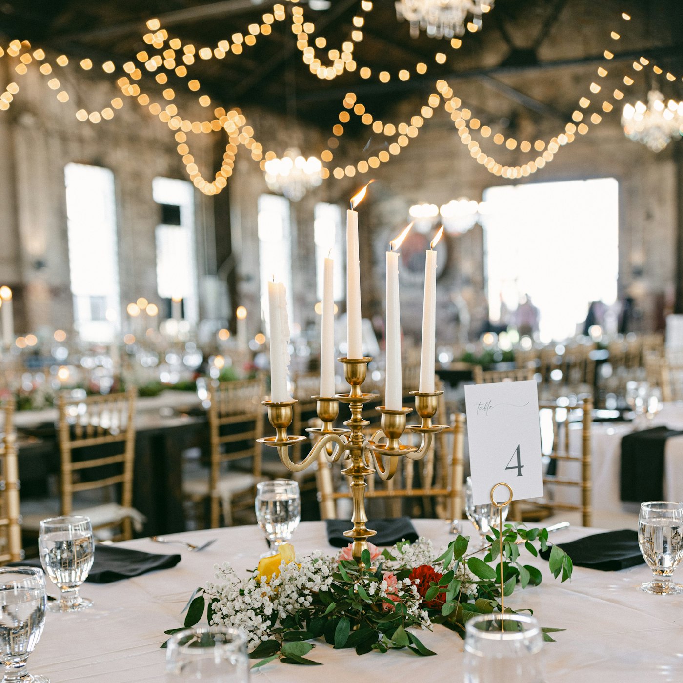 A table set with candles and flowers before the guests arrive