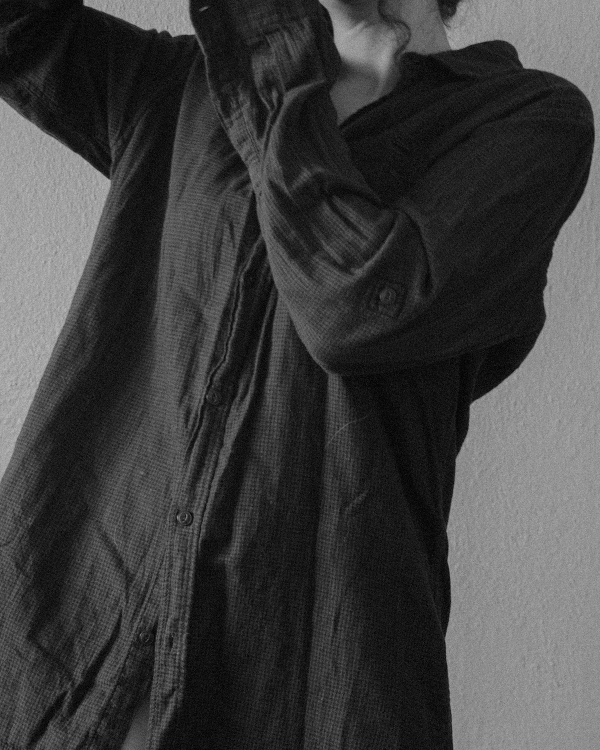 A black and white portrait in soft window light