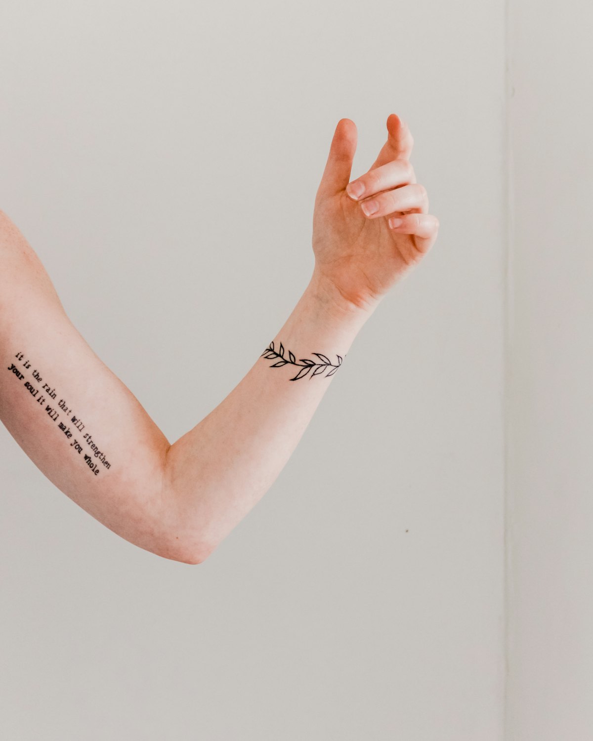 Small fine line script on an inner arm
