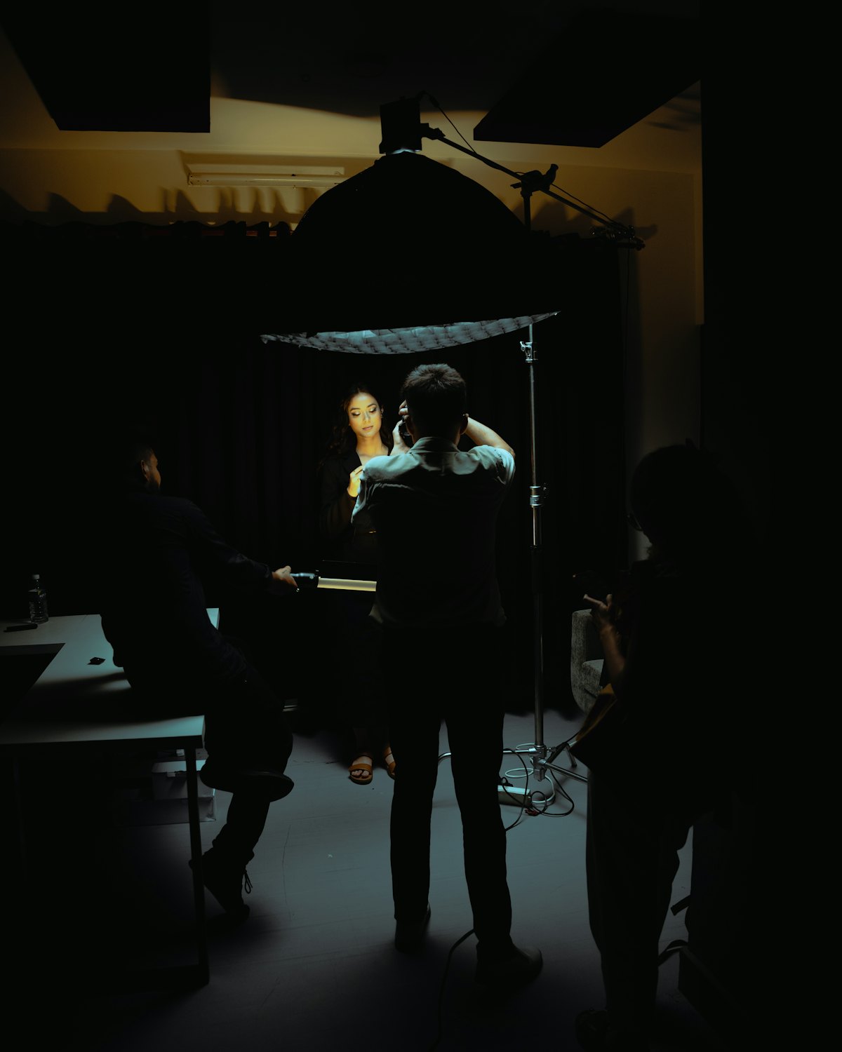 Dex standing in the dark studio between sessions